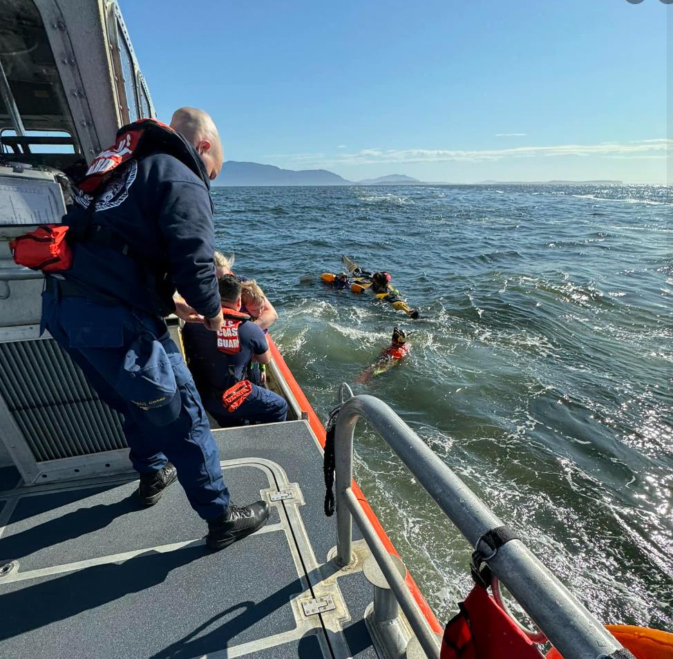 Bellingham, Wash – Coast Guard Station Bellingham and Coast Guard Air Station Port Angles rescue 4 adults, 1 child, and 1 dog near Lummi Island on June 9th. US Coast Guard photo from Station Bellingham.