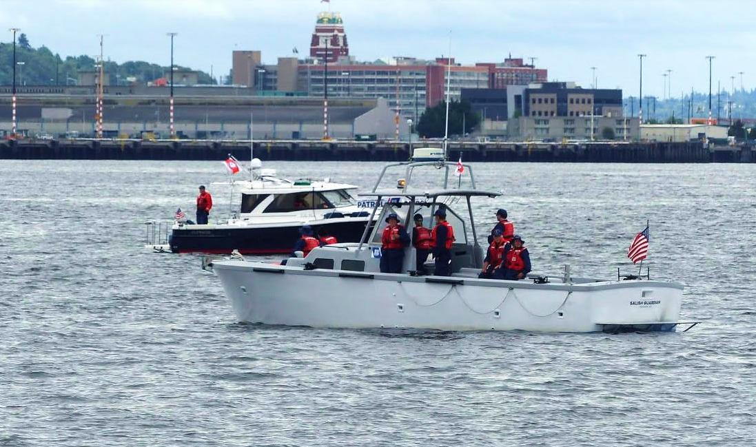 Seattle, Wash – Boat crew members escorting the USCGC Eagle. US Coast Guard photo.